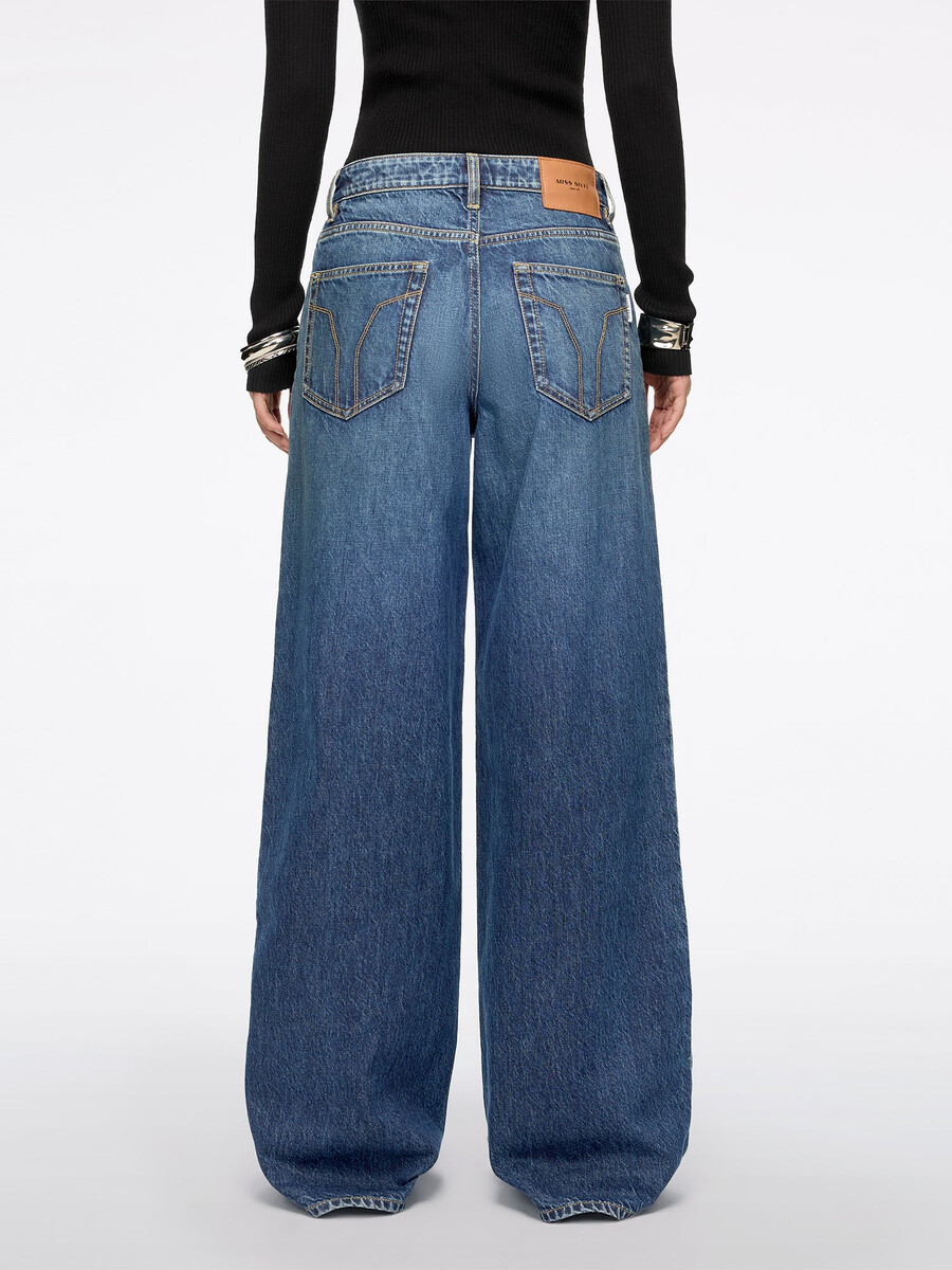 jeans mit schlitz und weitem bein