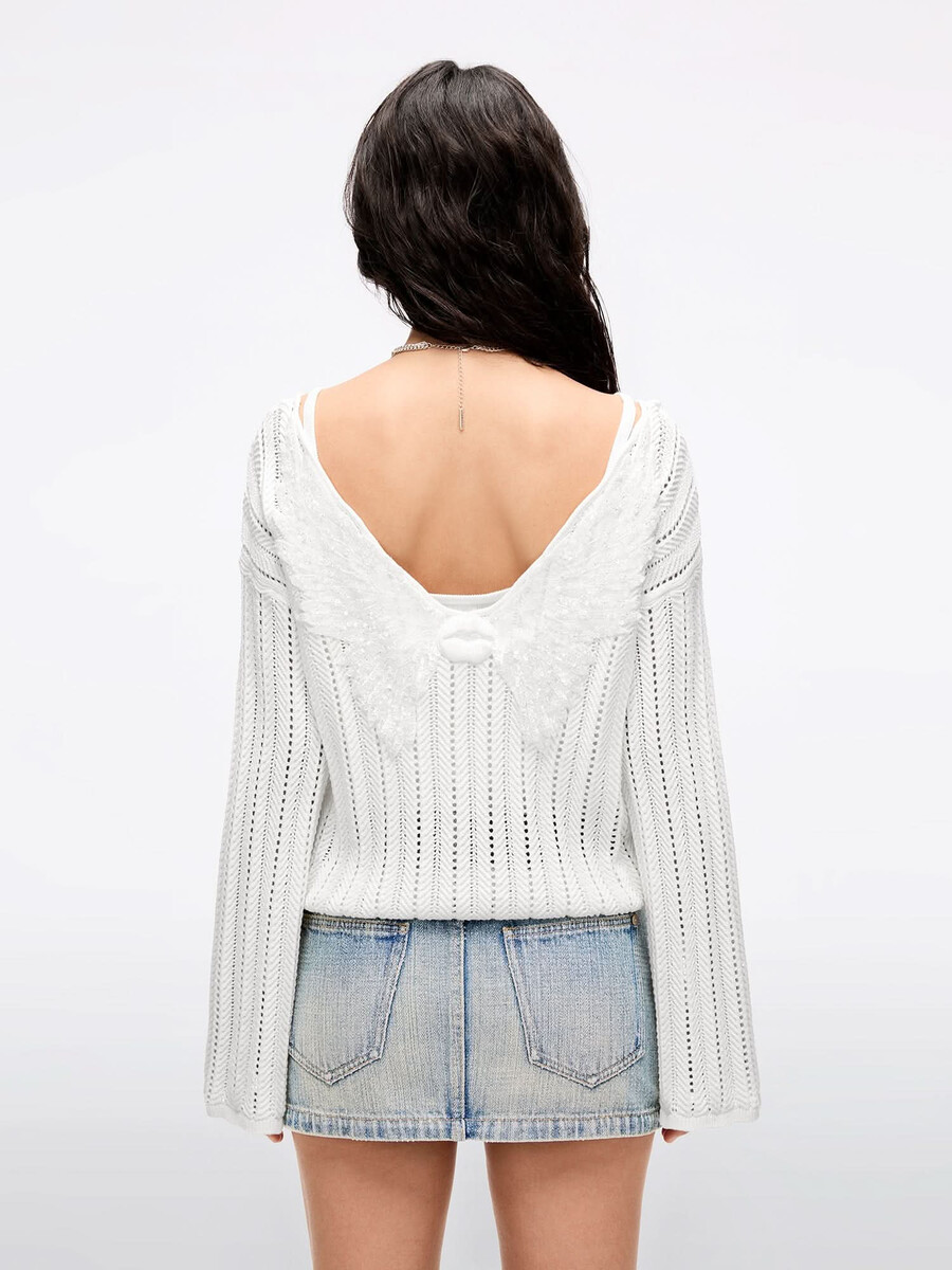 stricktop mit flügelverzierungen und perlen